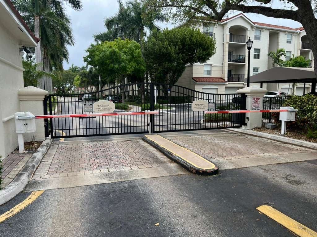 Commercial barrier arm controlling vehicle access at a business entrance