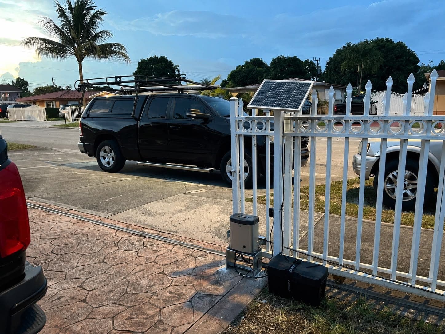 Solar-powered sliding gate operator installed at a Miami driveway